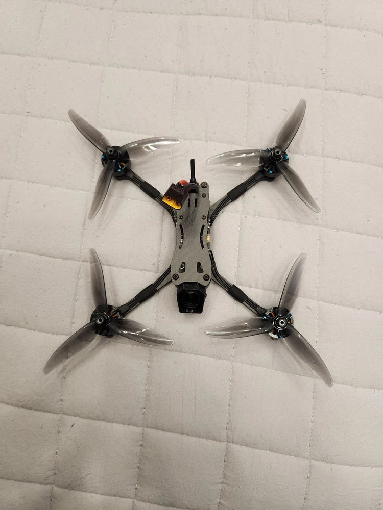 Custom 5-inch FPV race drone with four propellers and DJI O4 Air Unit RTF