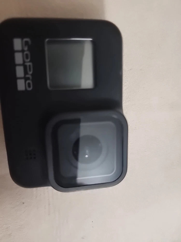 Black GoPro Hero 8 charging case with open battery compartment and display