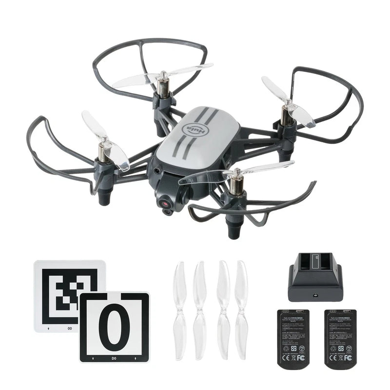 Foldable quadcopter drone with gimbal, four propellers, battery, and charging dock