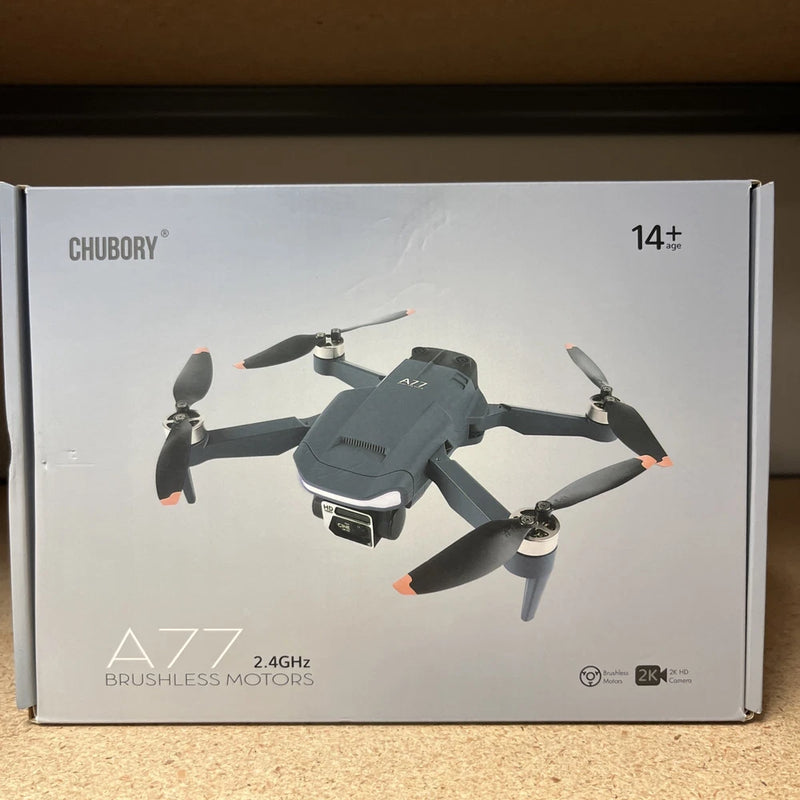 Gray quadcopter drone with four propellers and camera module on body
