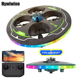 LED UFO foam drone with green/black circular body and handheld remote controller