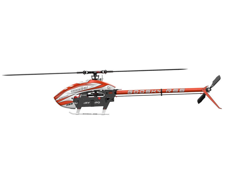 Orange electric helicopter kit with 3-blade rotor and detailed fuselage