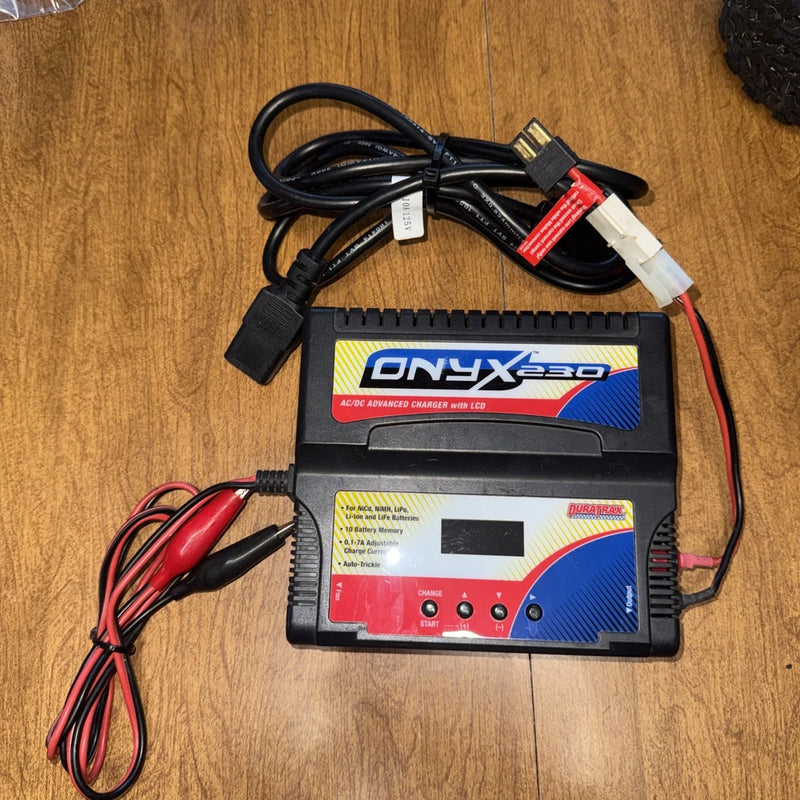 ONNyx 230 AC/DC battery charger with LCD screen and connected charging leads