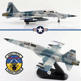 Gray-and-blue F-5F Tiger II model jet on display stand, detailed decals and insignia