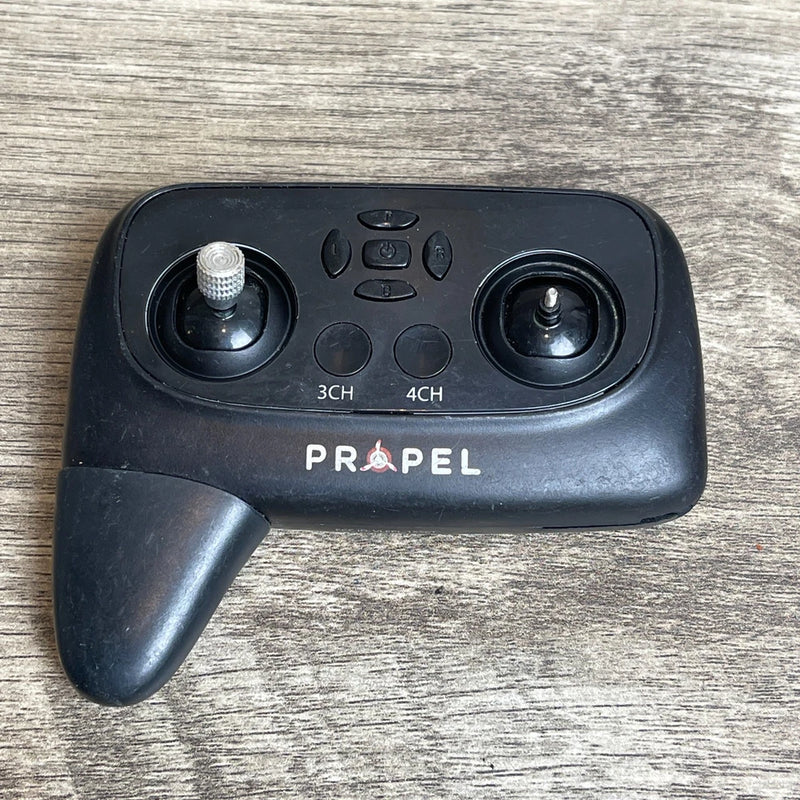 Black drone remote controller with two joysticks, buttons, and 3CH/4CH labels