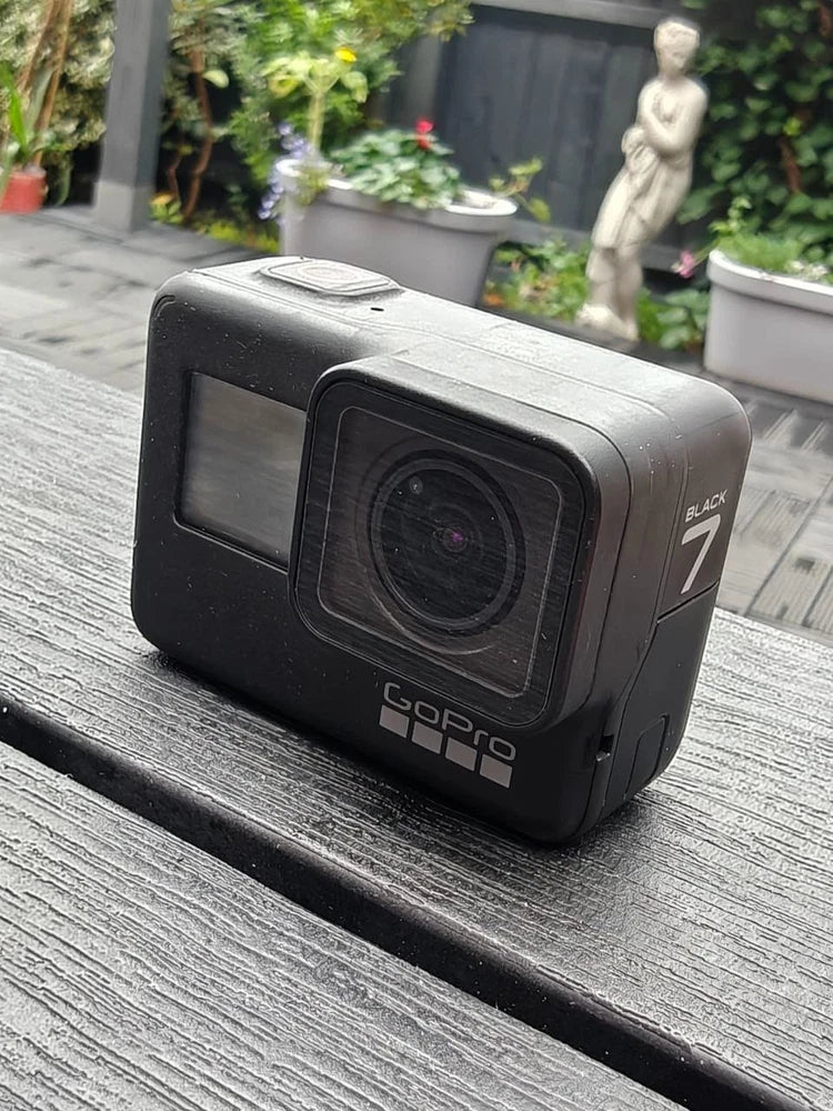 GoPro HERO7 Black action camera with front lens and small LCD screen