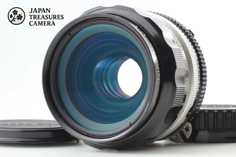 Wide-angle camera lens with front glass and knurled focus ring, black metal body