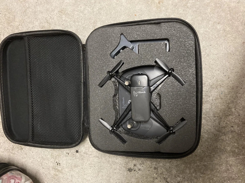 Drone with camera in black hard case, foldable quadcopter with four propellers
