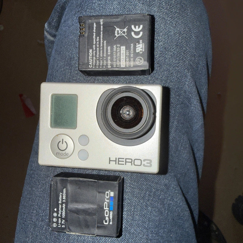 GoPro HERO3+ silver action camera with round lens, buttons, and visible battery