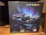 Folding dual-lens HD camera drone with remote controller, shown in retail box