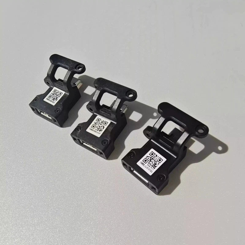 DJI Agras remote RTK adapter, black metal brackets with QR labels