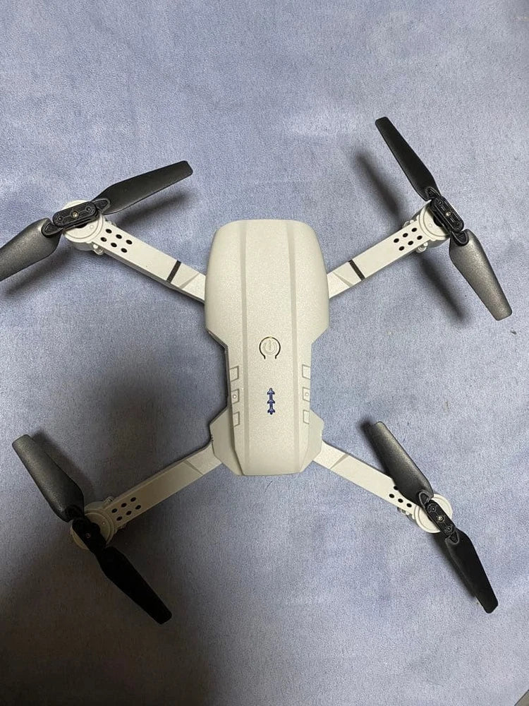 Mini RC toy quadcopter drone with four propellers, white body