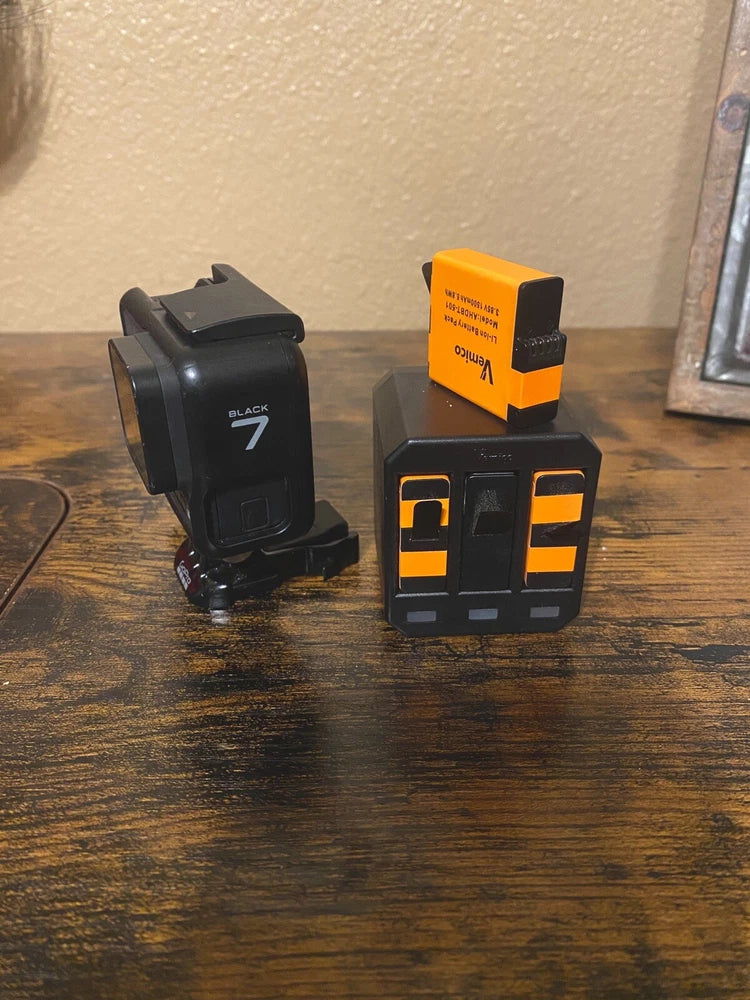 GoPro Hero7 Black action camera with mount and orange battery pack