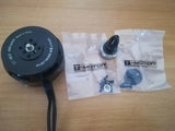 Black drone motor with prop shaft, wiring lead, and T-MOTOR hardware bag