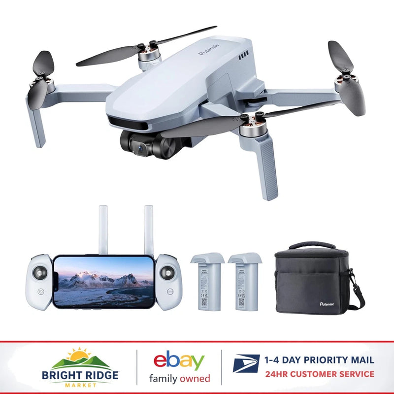 Foldable quadcopter drone with controller, spare batteries, and carrying bag