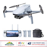 Foldable quadcopter drone with controller, spare batteries, and carrying bag