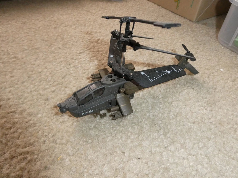 AH-64 RC micro helicopter model, dark gray with rotor blades