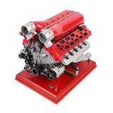 Red metal V12 engine model kit with motorized 4-stroke components on base