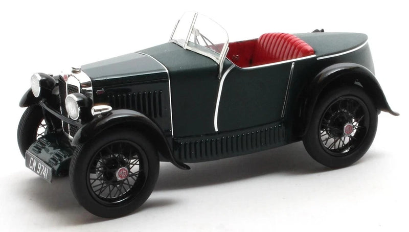 Vintage green convertible model car with red interior and black spoked wheels