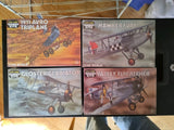 Four sealed model airplane kit boxes with illustrated planes, 1/48 scale