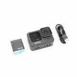 GoPro HERO9 Black action camera with lens module, face buttons, and small front display