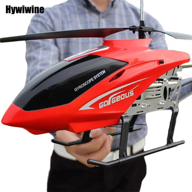Red and black remote control helicopter drone with landing skids and rotor blades