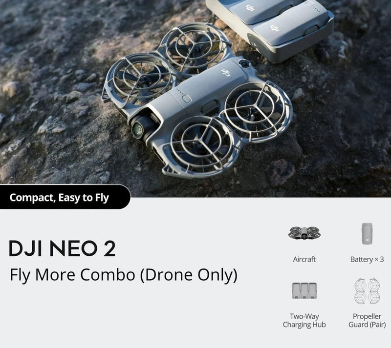 Grey quadcopter drone with four propellers and front camera
