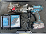 Cordless punch tool kit with Makita tool, battery, charger, and storage case