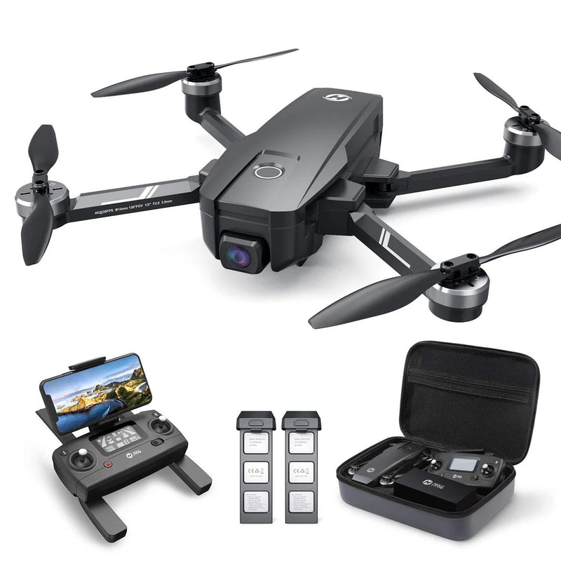 Black quadcopter drone with camera, foldable propellers and controller kit.