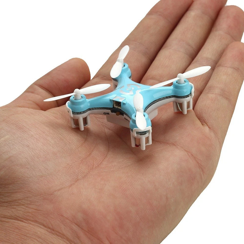 Light blue mini quadcopter RC drone with four propellers and landing legs