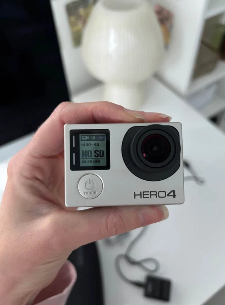 GoPro HERO4 action camera with front lens and small status screen