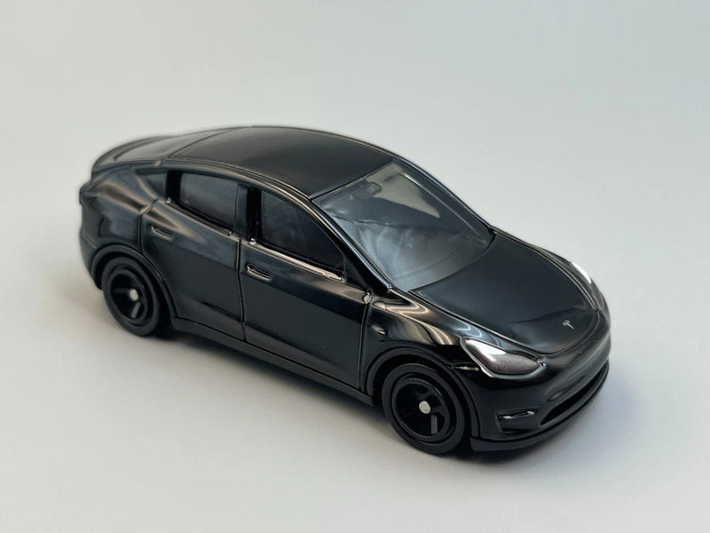Black Tesla Model Y 1/64 scale die-cast toy car, front-left 3/4 view