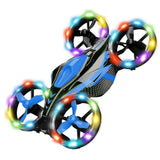 Toy quadcopter drone with blue body and black frame, four LED-lit propellers