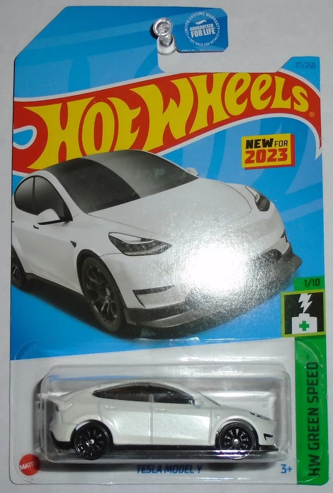 White 1/10 scale die-cast car in blister pack, Hot Wheels HW Green Speed 1/10