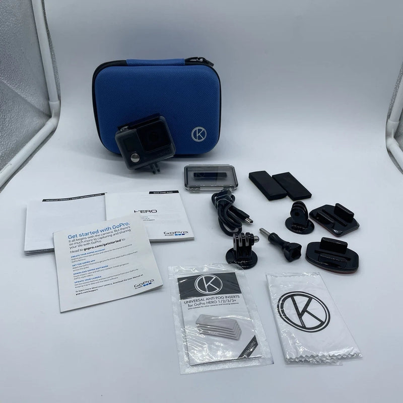 GoPro action camera accessory kit with blue hard case, mount, and cables