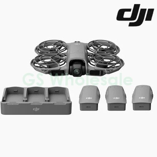 DJI quadcopter drone with propellers, charging dock, and three batteries