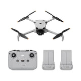 Quadcopter drone with remote controller and two batteries, white body