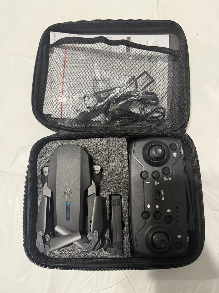 Foldable 4K dual-camera RC drone with black controller in zip case