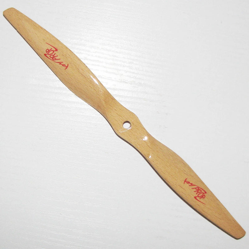Wooden RC propeller blade with center mounting hole, natural light wood tone.