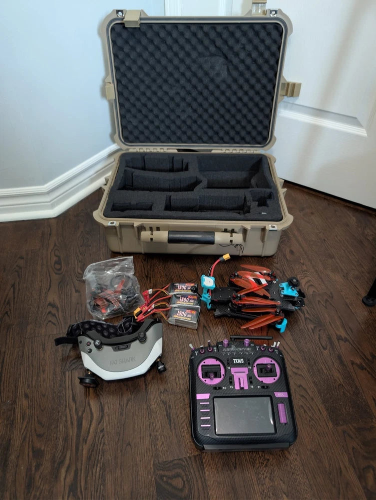 FPV drone kit in hard case with controller and assorted accessories