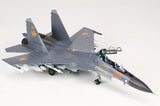 Grey fighter jet model with orange 09 markings, front view
