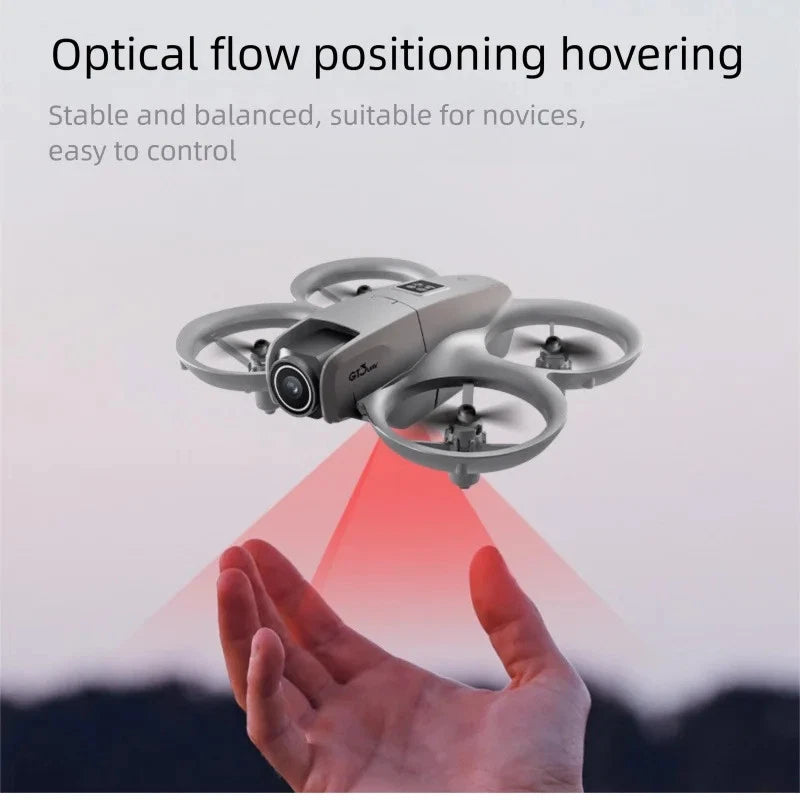 Gray quadcopter drone with dual cameras and four propellers