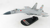 J-15 flying shark model aircraft in light gray on black display stand