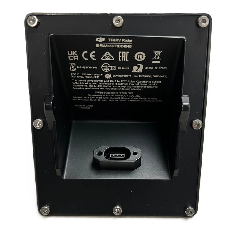 Backward vision radar module with black housing and USB-C connector, label on back