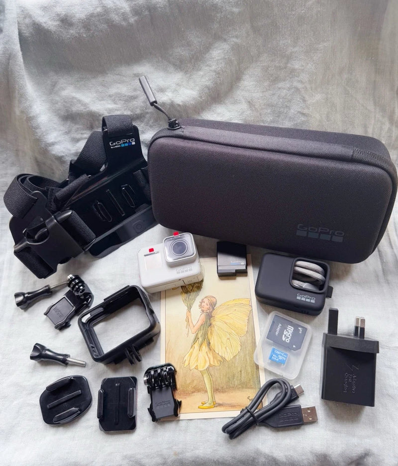 GoPro Hero7 action camera with dark case and assorted mounting accessories