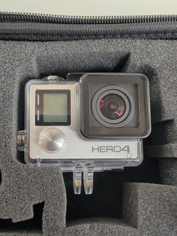 GoPro HERO4 action camera in clear housing with lens and LCD screen, silver
