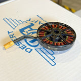 Brushless UAV motor with copper windings and silver mounting plate, circular front