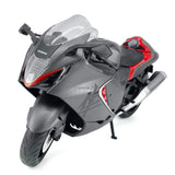 Gray diecast toy sport motorcycle with red accents, kickstand down, front 3/4 view.