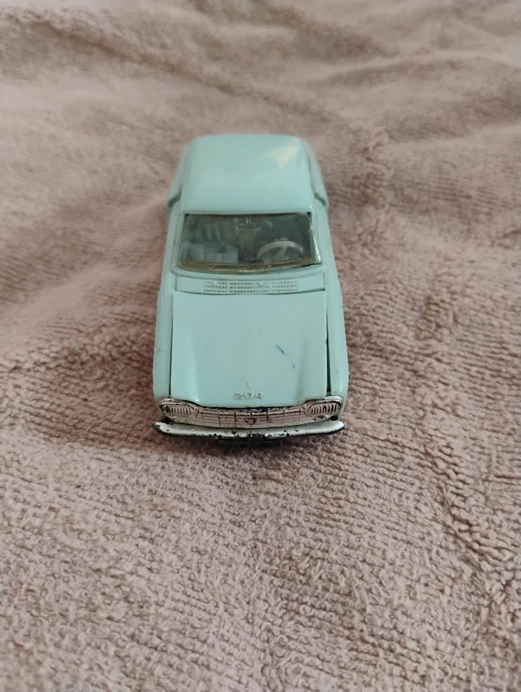 Vintage Norev Peugeot 204 coupe 1:43 model car, front view, light turquoise