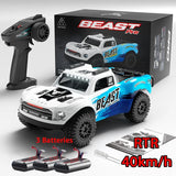 RC monster truck toy set with white and blue Beast Pro truck, remote, RTR box